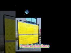 Yellow spray-painted perforated punched fence for good privacy